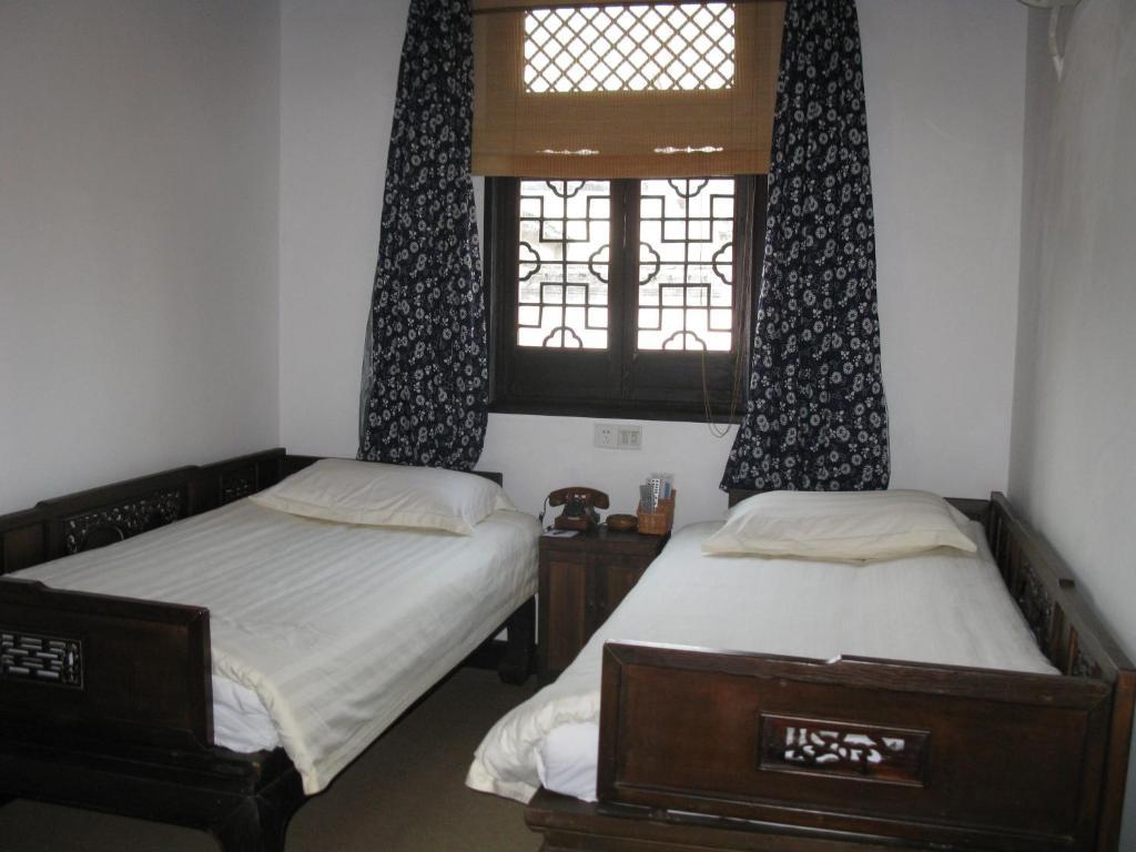XI Di Travel Lodge Ji Szoba fotó